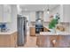 Modern kitchen with stainless steel appliances and light wood cabinets at 2226 Arlington St, Sarasota, FL 34239