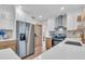 Bright kitchen with white cabinets, stainless steel appliances, and a view to backyard at 2226 Arlington St, Sarasota, FL 34239