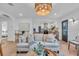 Open concept living and dining room with light hardwood floors at 2226 Arlington St, Sarasota, FL 34239