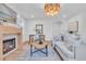 Light and airy living room with a fireplace and a stylish light-colored sofa at 2226 Arlington St, Sarasota, FL 34239