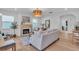 Bright living room featuring a fireplace, light hardwood floors, and ample natural light at 2226 Arlington St, Sarasota, FL 34239