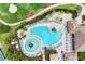 Resort-style pool with lounge chairs, lush landscaping, and golf course views at 234 River Enclave Ct, Bradenton, FL 34212