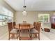 Dining area with large table and six chairs at 234 River Enclave Ct, Bradenton, FL 34212