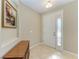 Bright entryway with tile floor and console table at 234 River Enclave Ct, Bradenton, FL 34212