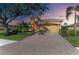 Single-story home with brick driveway and landscaped yard at 234 River Enclave Ct, Bradenton, FL 34212