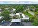 Aerial view of condos with carport and landscaping at 2421 Crispin Ct # E3, Sarasota, FL 34235