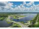 Aerial view of lake, park, and road at 2421 Crispin Ct # E3, Sarasota, FL 34235
