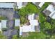 Bird's-eye view of a home with surrounding buildings and greenery at 2421 Crispin Ct # E3, Sarasota, FL 34235