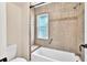 Updated bathroom with a shower/tub combo and tile surround at 2421 Crispin Ct # E3, Sarasota, FL 34235