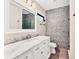 Bathroom with marble countertop and a frameless shower at 2421 Crispin Ct # E3, Sarasota, FL 34235