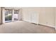 Simple bedroom with carpet flooring and sliding glass doors at 2421 Crispin Ct # E3, Sarasota, FL 34235
