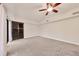 Large bedroom with sliding glass doors and ceiling fan at 2421 Crispin Ct # E3, Sarasota, FL 34235