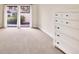 Empty bedroom with carpet flooring and patio access at 2421 Crispin Ct # E3, Sarasota, FL 34235