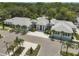 Modern clubhouse with grey tile roof and white facade at 2421 Crispin Ct # E3, Sarasota, FL 34235
