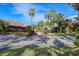 Community clubhouse with palm trees and landscaping at 2421 Crispin Ct # E3, Sarasota, FL 34235