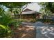 Community clubhouse with lush landscaping at 2421 Crispin Ct # E3, Sarasota, FL 34235