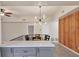 Bright dining area with a modern light fixture and wood wall accents at 2421 Crispin Ct # E3, Sarasota, FL 34235