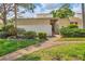 Attractive condo entrance with landscaping and walkway at 2421 Crispin Ct # E3, Sarasota, FL 34235