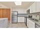 Modern kitchen with stainless steel appliances and granite countertops at 2421 Crispin Ct # E3, Sarasota, FL 34235