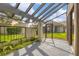 Screened patio with pergola and lush tropical landscaping at 2421 Crispin Ct # E3, Sarasota, FL 34235
