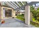 Covered patio with access to the interior and grassy backyard at 2421 Crispin Ct # E3, Sarasota, FL 34235