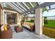 Relaxing covered patio with wicker furniture and lush landscaping at 2421 Crispin Ct # E3, Sarasota, FL 34235