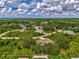 Aerial view of a residential neighborhood with lush green landscaping at 2534 Stagnaro Rd, North Port, FL 34287