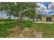 Large backyard with grassy area and patio at 2534 Stagnaro Rd, North Port, FL 34287