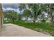 Large backyard with grassy area and patio at 2534 Stagnaro Rd, North Port, FL 34287
