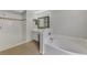 Bathroom boasts a bathtub, shower, and double vanity at 2534 Stagnaro Rd, North Port, FL 34287