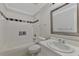 Small bathroom with shower/tub combo and vanity at 2534 Stagnaro Rd, North Port, FL 34287