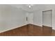 Bedroom with wood-look floors and access to the kitchen at 2534 Stagnaro Rd, North Port, FL 34287