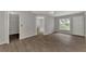 Bedroom with wood-look floors, bathroom access, and closet at 2534 Stagnaro Rd, North Port, FL 34287