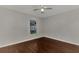 Simple bedroom with wood-like floors and a window at 2534 Stagnaro Rd, North Port, FL 34287