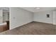 Spacious bedroom with wood-look floors and ceiling fan at 2534 Stagnaro Rd, North Port, FL 34287
