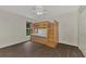 Bright bedroom with wood flooring and a built-in bunk bed at 2534 Stagnaro Rd, North Port, FL 34287