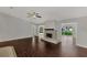 Spacious living room with fireplace and dark wood flooring at 2534 Stagnaro Rd, North Port, FL 34287