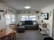 Cozy living room with a comfortable sectional sofa and built-in shelving at 2601 Gulf N Dr # 729, Bradenton Beach, FL 34217
