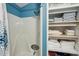 Bathroom with shower, linen closet and decorative shower curtain at 283 Bainbridge Dr, Nokomis, FL 34275