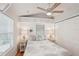 Cozy bedroom with ceiling fan, window blinds, and built in storage at 283 Bainbridge Dr, Nokomis, FL 34275