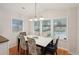 Spacious dining area with large windows and a view of the backyard at 283 Bainbridge Dr, Nokomis, FL 34275