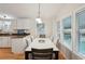 Bright dining area with a table and chairs, located near the kitchen at 283 Bainbridge Dr, Nokomis, FL 34275