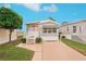 Cute manufactured home with gray siding, landscaped yard, and spacious driveway at 283 Bainbridge Dr, Nokomis, FL 34275
