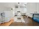 White kitchen with granite countertops, stainless steel appliances, and ample storage at 283 Bainbridge Dr, Nokomis, FL 34275
