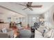 Open concept living and dining area, featuring coastal decor and hardwood floors at 283 Bainbridge Dr, Nokomis, FL 34275