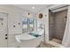Spa-like bathroom with a freestanding tub and walk-in shower at 305 Pameto Rd, Nokomis, FL 34275
