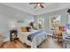Bright bedroom with wood floors and backyard view at 305 Pameto Rd, Nokomis, FL 34275