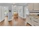 Bright dining area with hardwood floors and access to kitchen at 305 Pameto Rd, Nokomis, FL 34275