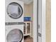 Laundry room with washer, dryer, and cabinet at 305 Pameto Rd, Nokomis, FL 34275