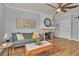 Living room with hardwood floors, fireplace, and a ceiling fan at 305 Pameto Rd, Nokomis, FL 34275